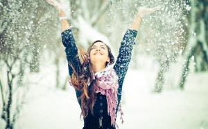 beautiful-girl-throwing-and-enjoying-snow
